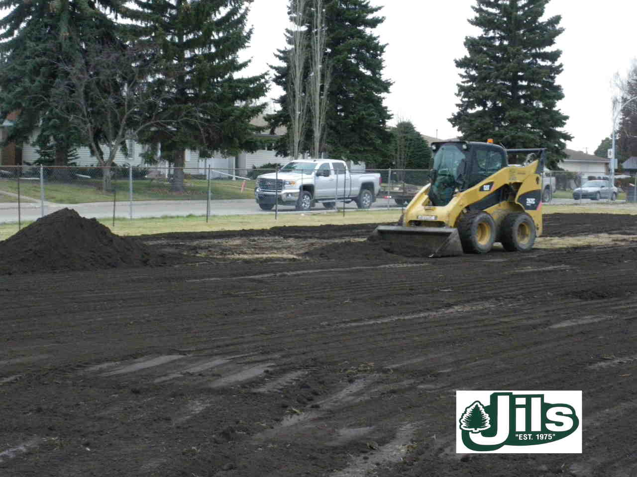 Bobcat moving topsoil
